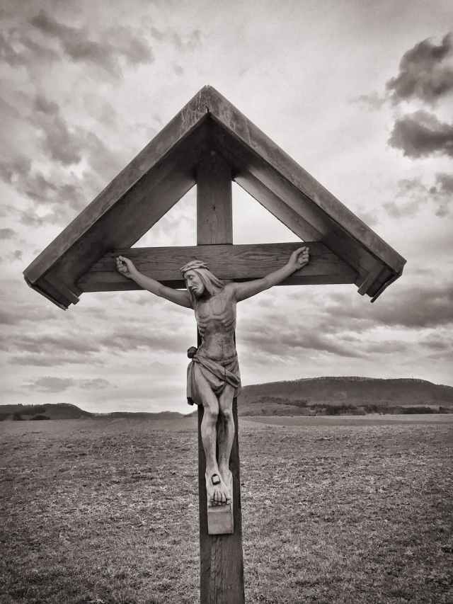 crucifix grayscale photo