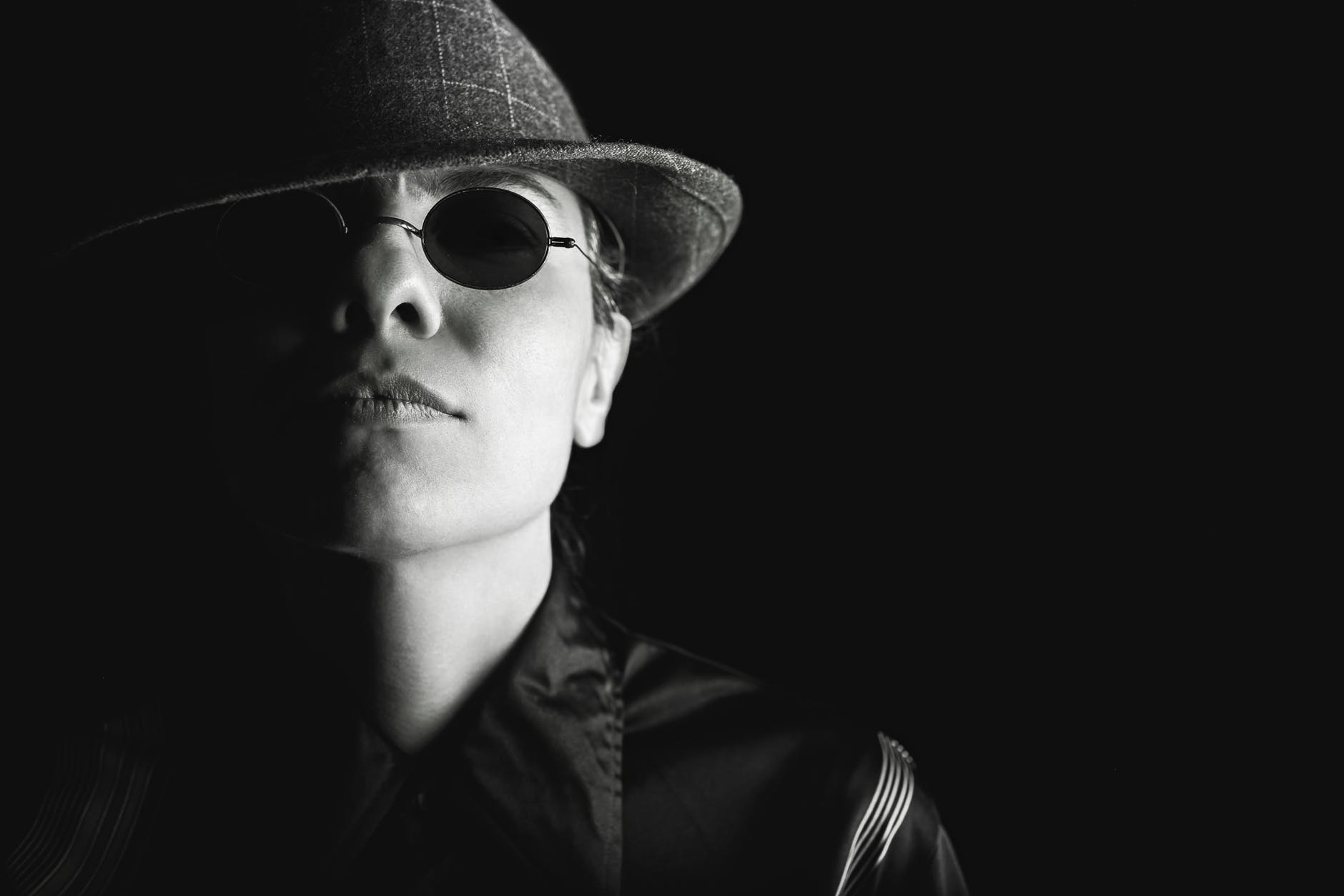 person sunglasses dark hat