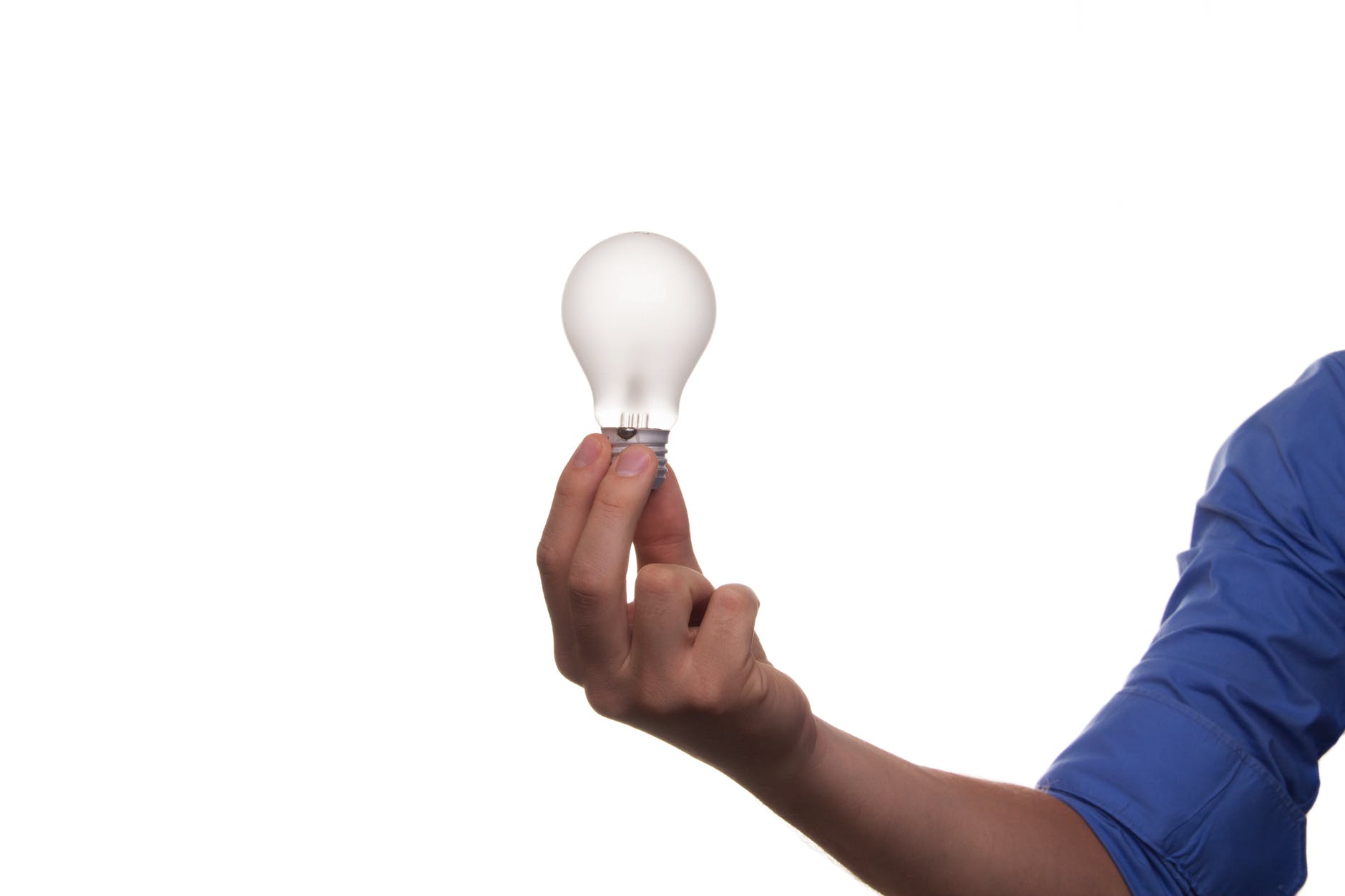 midsection of man holding hands over white background