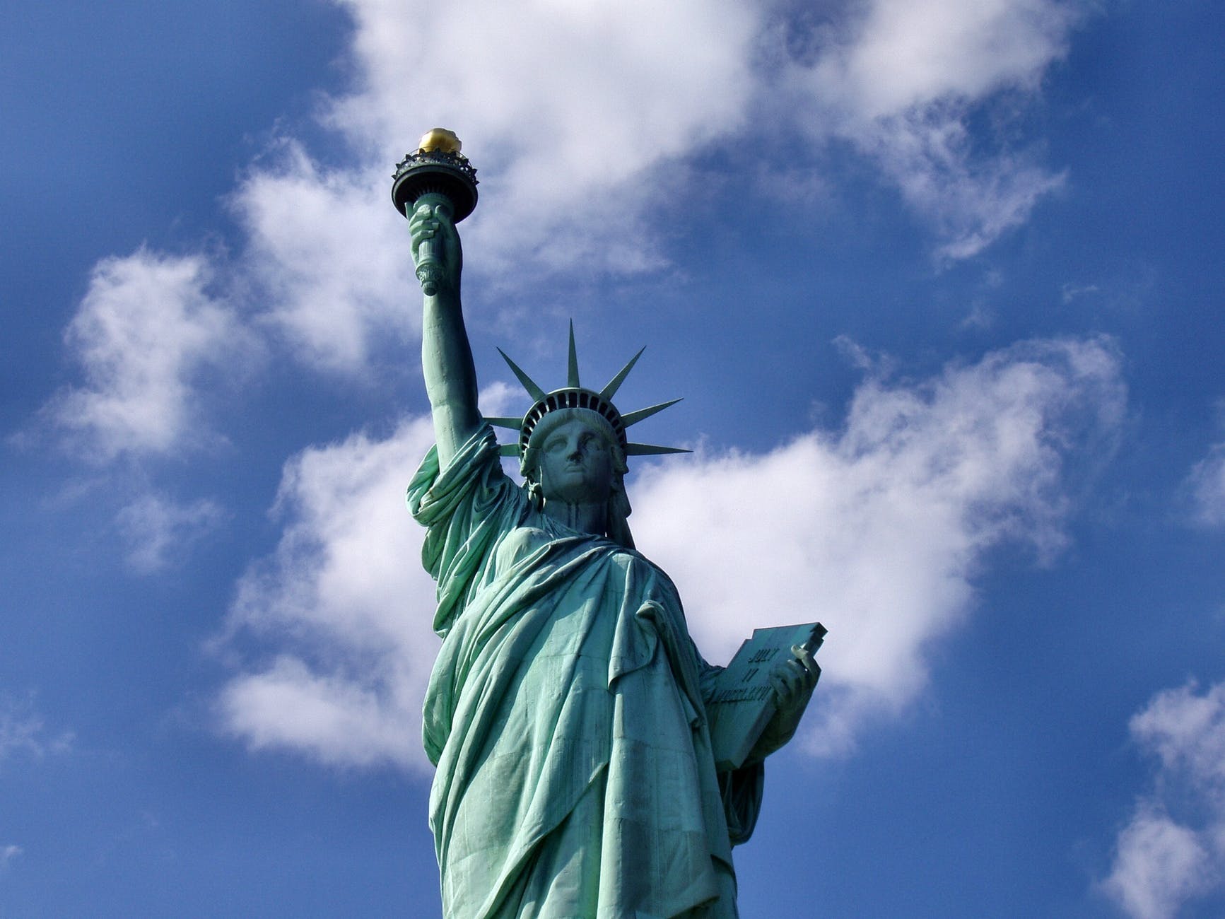 statue of liberty in new york during daytime