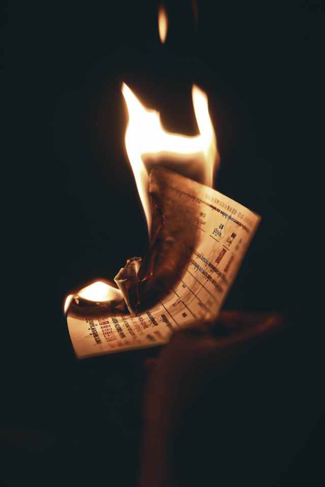 burning paper inside dark room