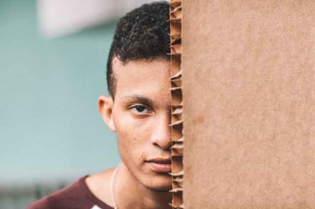 unknown celebrity taking selfie outdoors