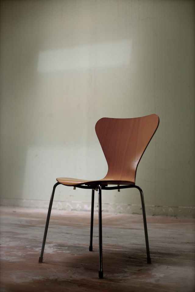 brown and black chair on brown surface