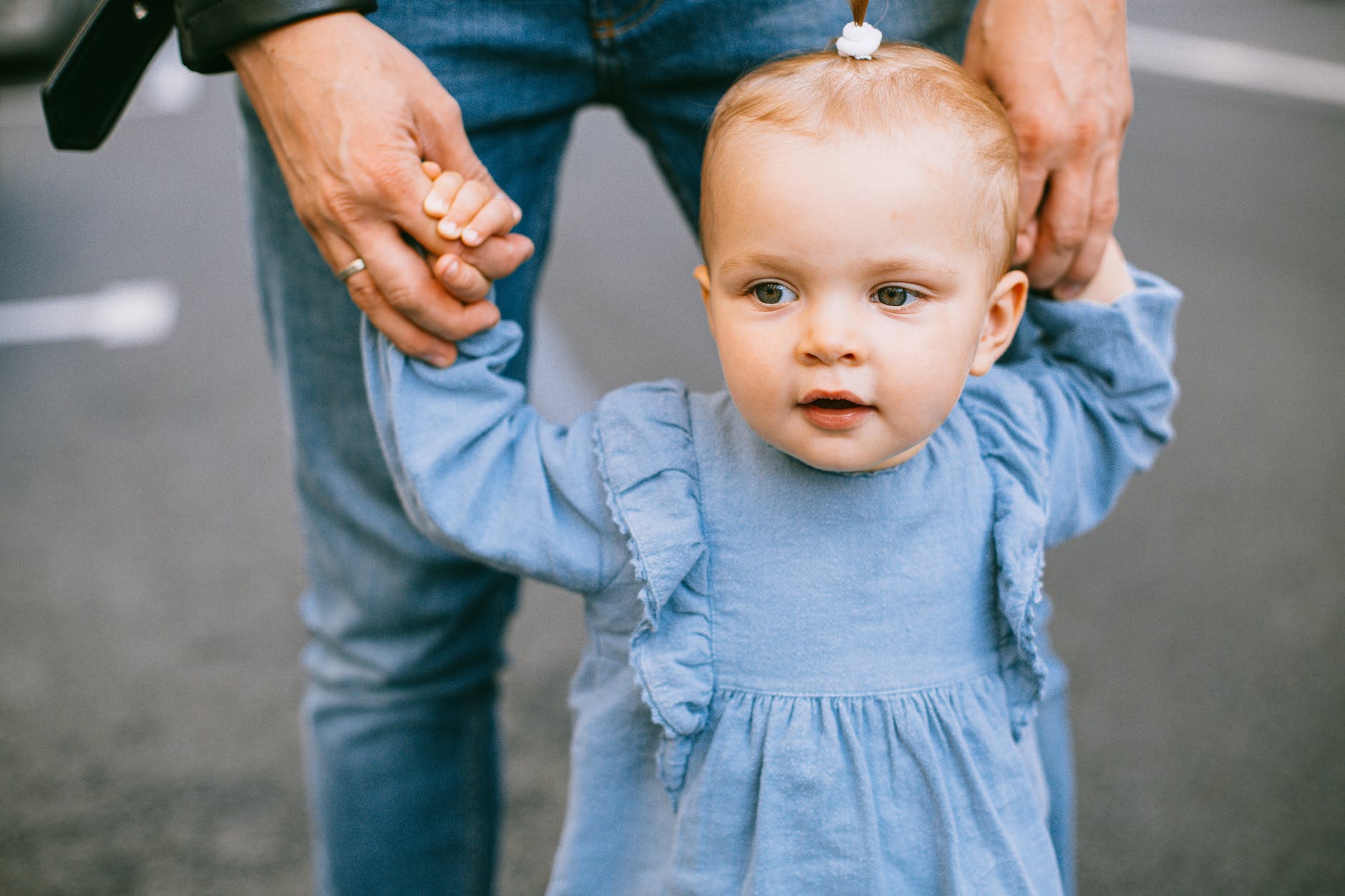 baby in blue long sleeved shirt