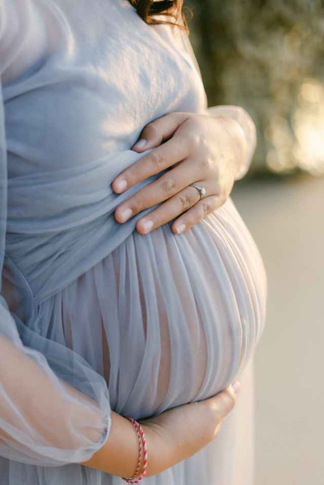 woman in blue dress wearing silver ring