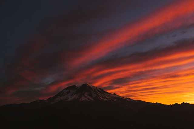 photo of mountain under red sky
