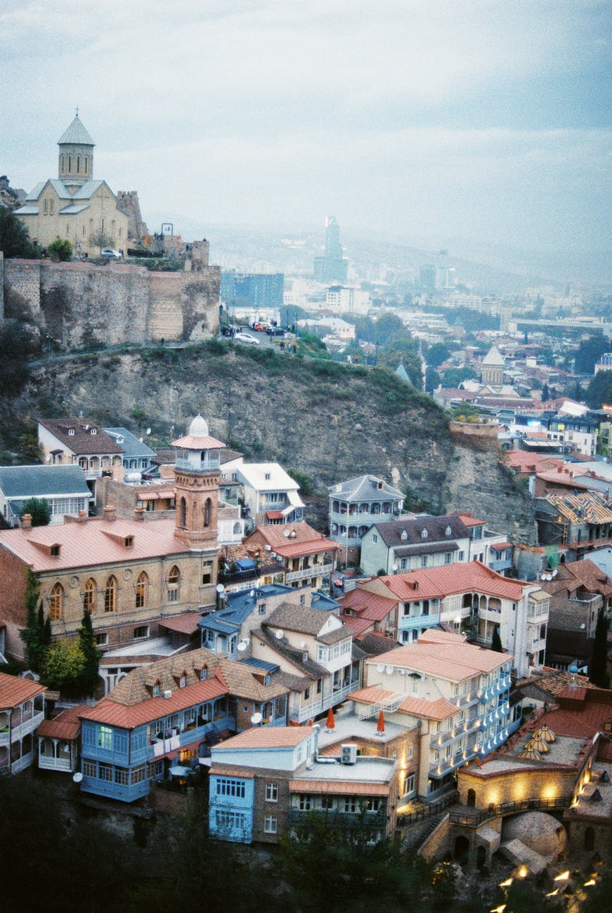 old town with buildings under cloudy sky